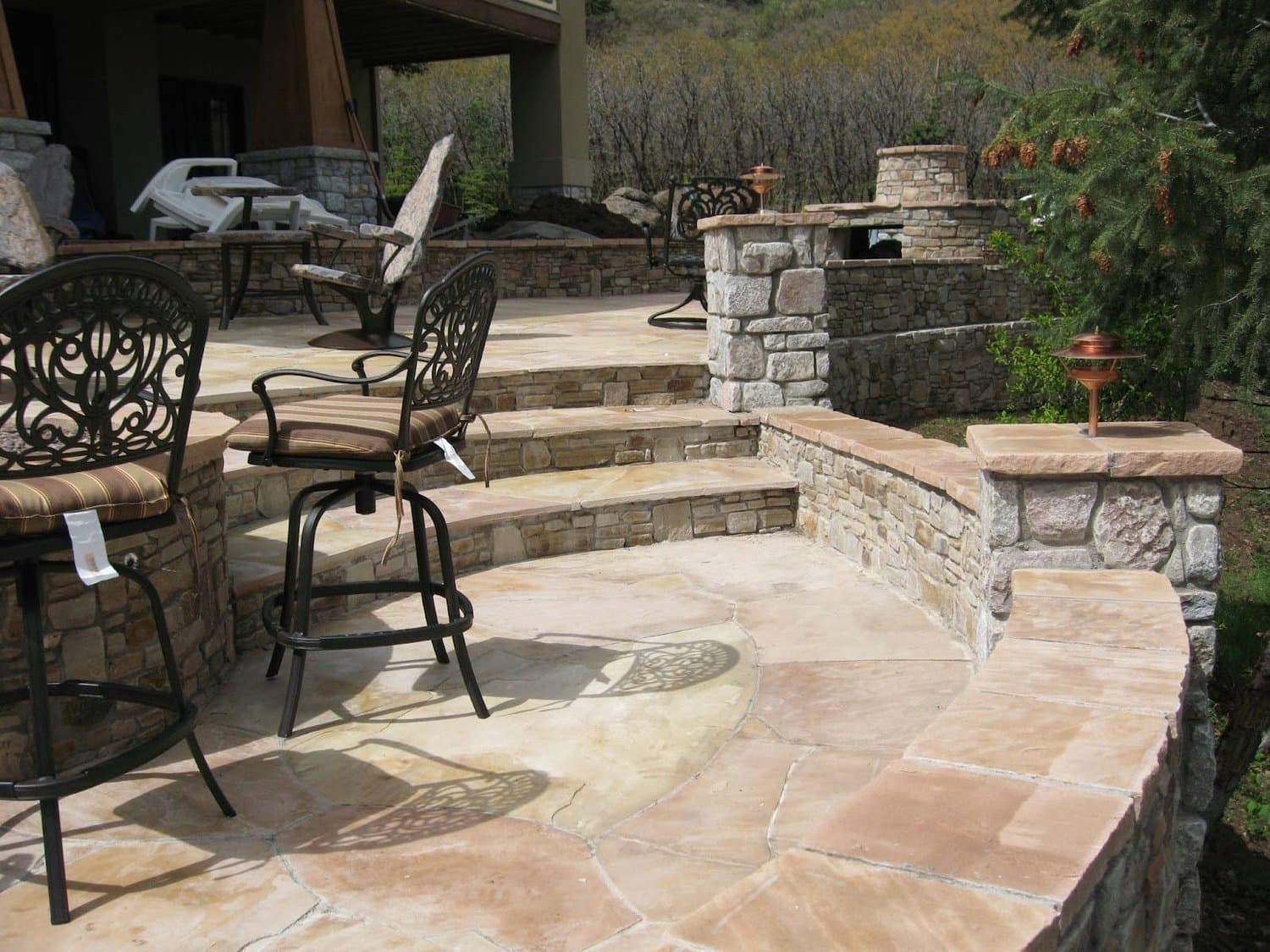 Outdoor kitchen and dining patio by J&P Landscaping